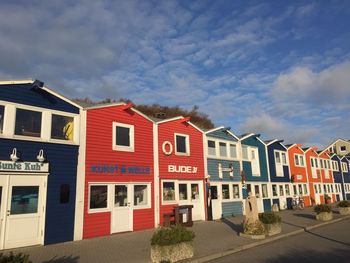 Houses against sky in city