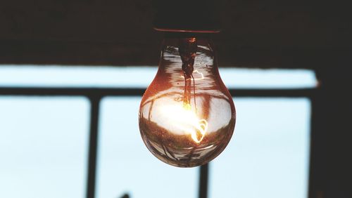 Close-up of illuminated light bulb