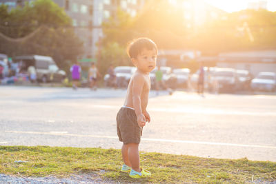 Portrait of cute boy in city