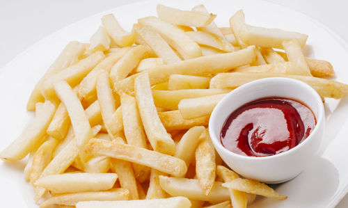 Close-up of pasta with fries