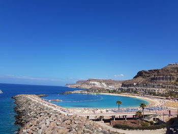 Scenic view of sea against blue sky