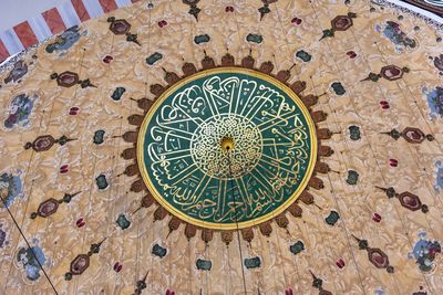 Low angle view of clock on wall