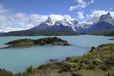 Scenic view of lake and mountains against sky