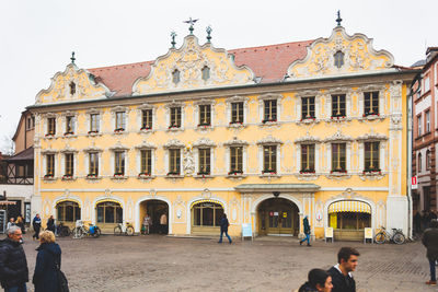 Group of people in front of historic building