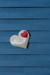 Loving fabric hearts on a blue background, perfect for valentine's day