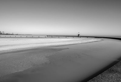 Scenic view of beach against clear sky