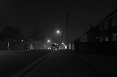 Illuminated street lights at night