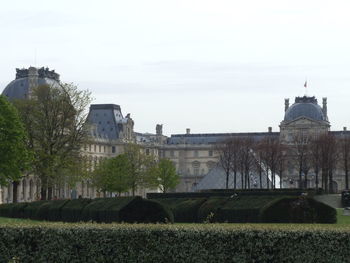 Built structure with trees in foreground