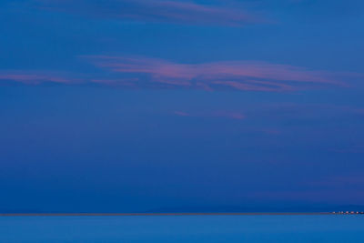 Scenic view of sea against blue sky