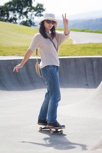 Full length of young woman jumping