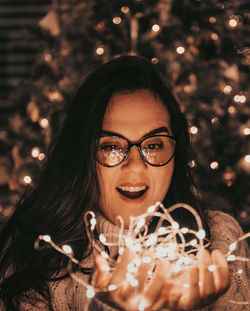 Portrait of young woman wearing sunglasses