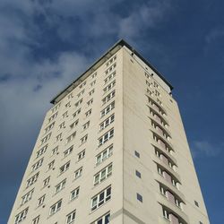 Low angle view of apartment building against sky