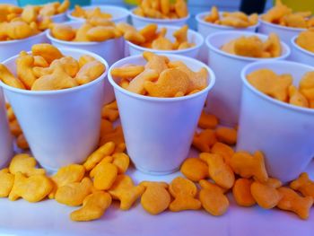 Close-up of cups of fish shaped crackers