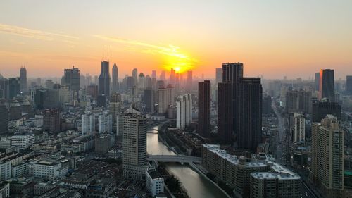 High angle view of cityscape against sky during sunset