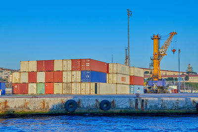 View of commercial dock against clear blue sky