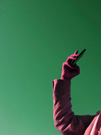 Midsection of man using mobile phone