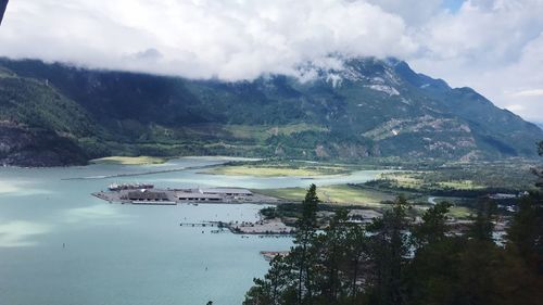 High angle view of trees and mountains against sky