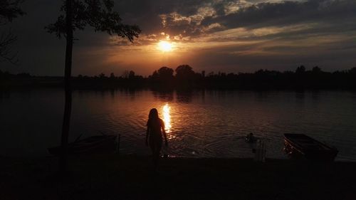 Scenic view of lake at sunset
