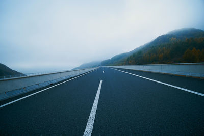 Empty road against sky