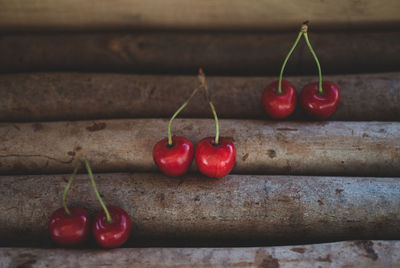 Close-up of red chili peppers on wood