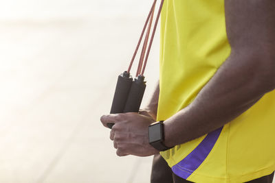 Close-up of man holding umbrella