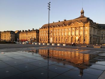 Buildings with reflection at place de la bourse bordeaux france