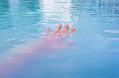 Low section of woman in swimming pool