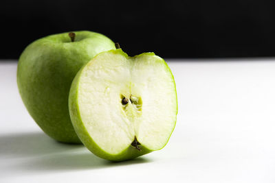Close-up of apple against black background
