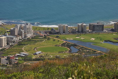 High angle view of cityscape by sea