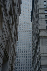 Low angle view of buildings on wall street