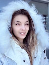 Portrait of smiling young woman in winter