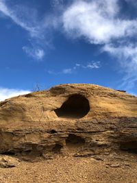 Rock formation on land against sky