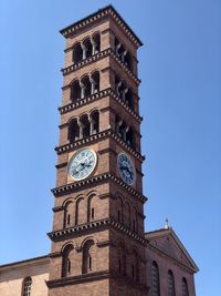 Low angle view of clock tower against sky