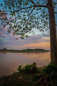 Scenic view of lake against sky during sunset