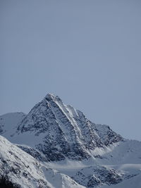 Scenic view of snowcapped mountains against clear sky