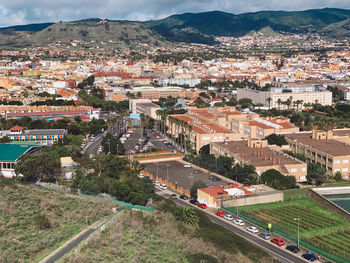 High angle view of road amidst buildings in town