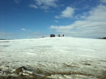 Scenic view of landscape against sky during winter