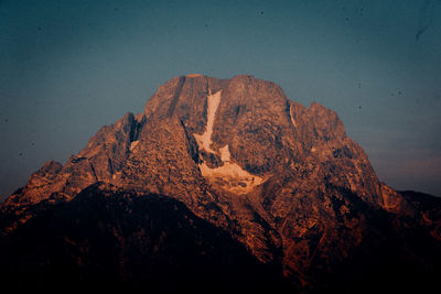 Rock formations on mountain against sky