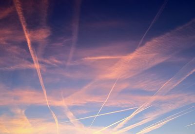 Low angle view of vapor trails in sky