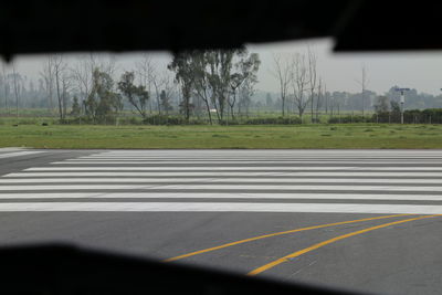 Road seen through car windshield