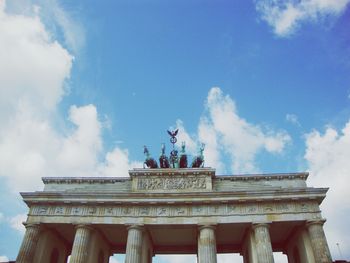 Low angle view of statue against cloudy sky