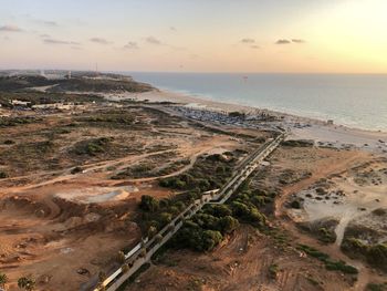 High angle view of beach against sky during sunset