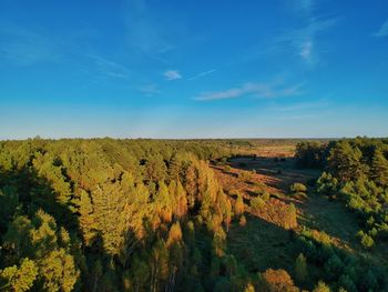 Scenic view of landscape against blue sky