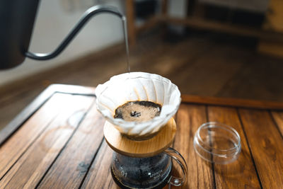 High angle view of coffee cup on table