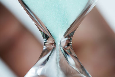 High angle view of clock on glass table