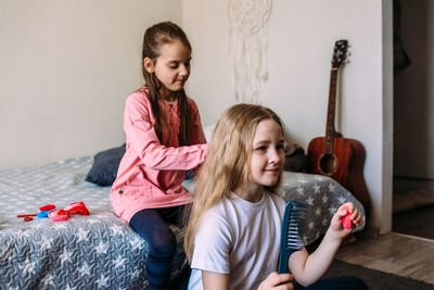 Portrait of mother and daughter at home