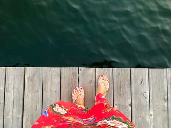 Low section of woman on pier