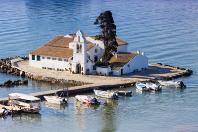 High angle view of buildings by sea