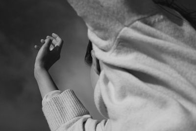 Close-up portrait of woman holding hands