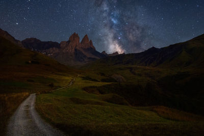 Scenic view of mountains against sky at night